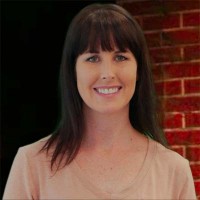 Janet Weber Smiling woman with shoulder-length dark hair and bangs